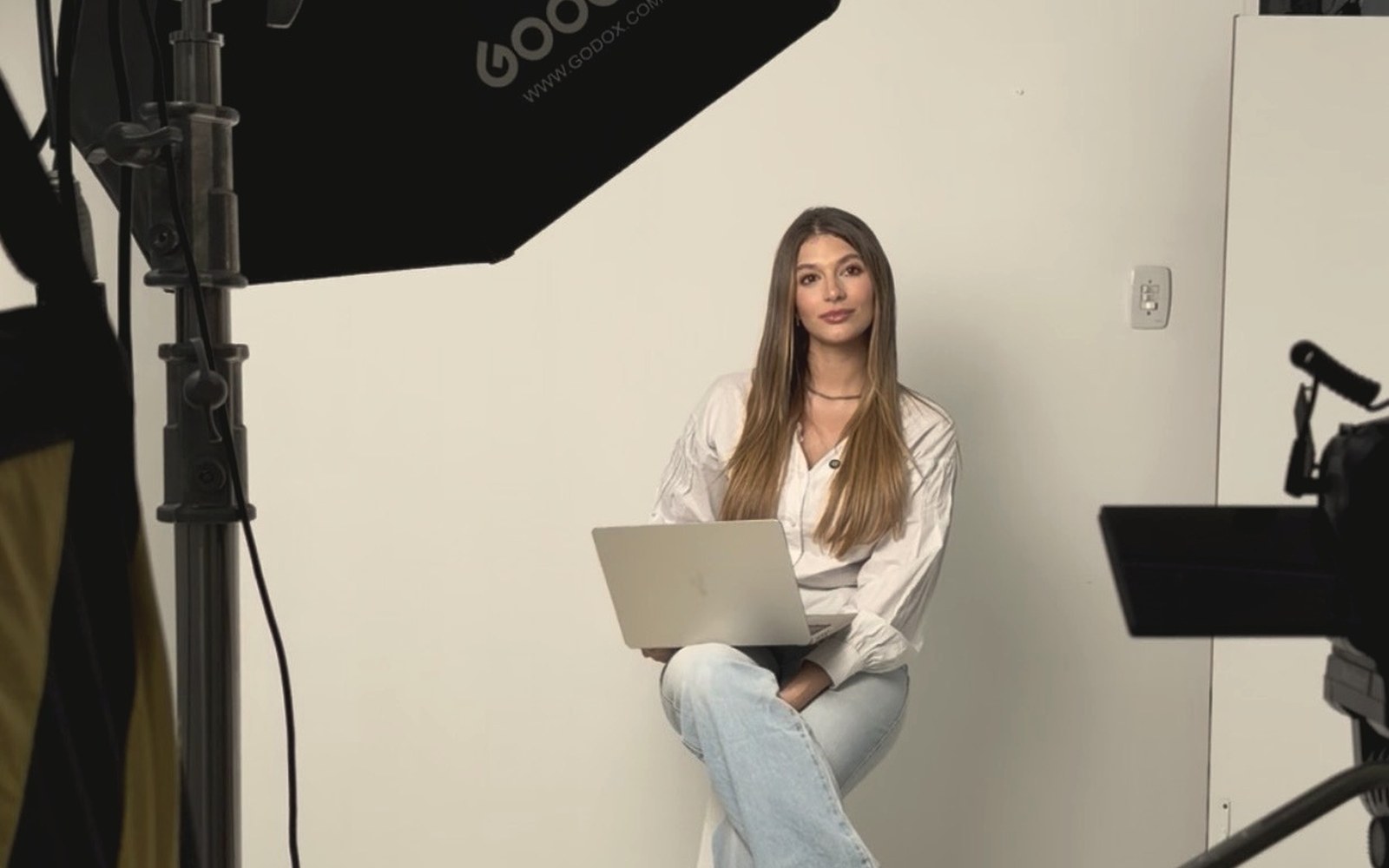 Studio setup with softbox lighting, camera rig and seamless backdrop